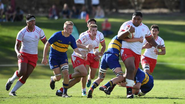 Ipswich Grammar School prop Romeo Tanielu runs the ball against Toowoomba Grammar.