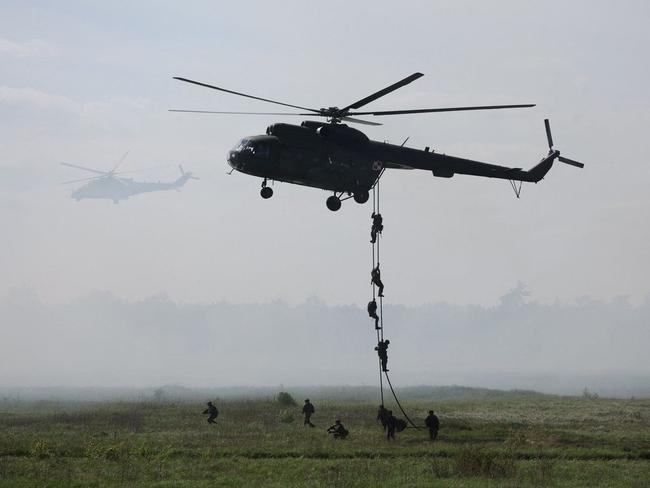 Polish soldiers land from a helicopter during a military exercise of NATO troops near Orzysz, Poland, in May. Picture: Kacper Pempel/Reuters/WSJ