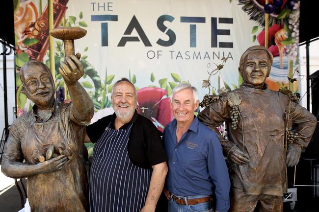 The Taste of Tasmania. John Caire of Festival Tempura Mushrooms and Fred Peacock of Bream Creek Vineyard and the statues created in honor of their 30 years of Taste participation.