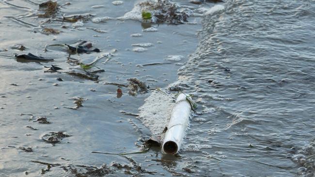 A sunken houseboat at Paradise Point is polluting local waterways . Picture Glenn Hampson