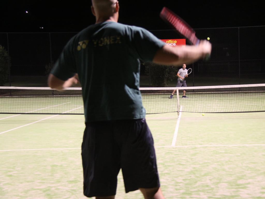 LOVE-ALL: East Lismore Tennis Club president Michael Oaten (facing) said members are able to play single matches using quarantine processes approved by Tennis NSW during the pandemic to keep fit and positive.  Photo: Alison Paterson.