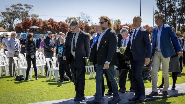 Pall bearers Peter Motley, Brett Motley, Warren Tredrea, Max James, Rick Trembath and Shaun Rehn at the funeral of Geof Motley at Alberton Oval. Picture: Emma Brasier