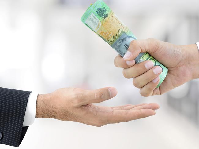 Businessman hands passing money, Australian dollar bills, tax refund generic