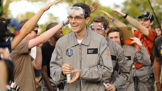 Tim competing during a rocket building challenge.