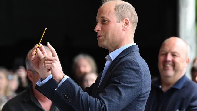 First, William had a go at conducting. (Photo by Ashley Crowden – WPA Pool/Getty Images)