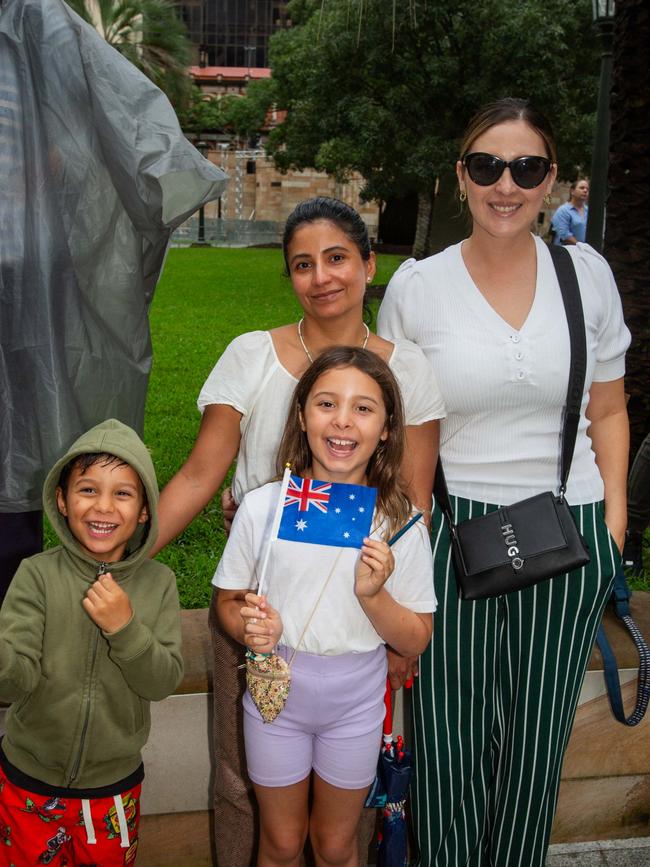 Thousands of people have braved the rain to gather in Brisbane for Anzac Day services. Picture: Grace Kessels