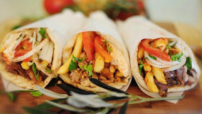 Meat, chips, onion, tomato, tzatziki and mustard are the traditional fillings in a pita gyros or pita souvlaki. Photo: Sylvia Gabrel Photography