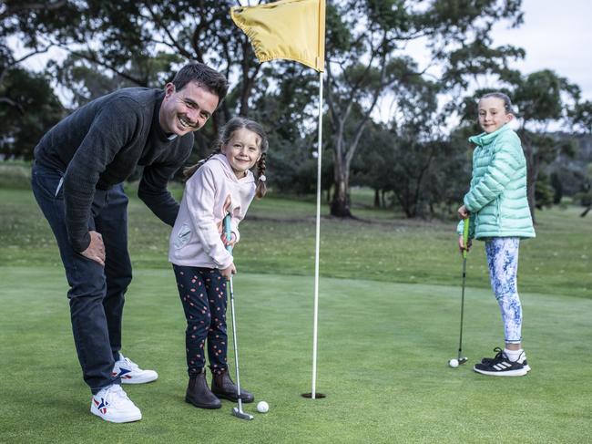 Owen Tubb and his daughters Madeline, 5, and Alexandra, 8, play a round at the Rosny public golf course before its closure. Picture: Eddie Safarik