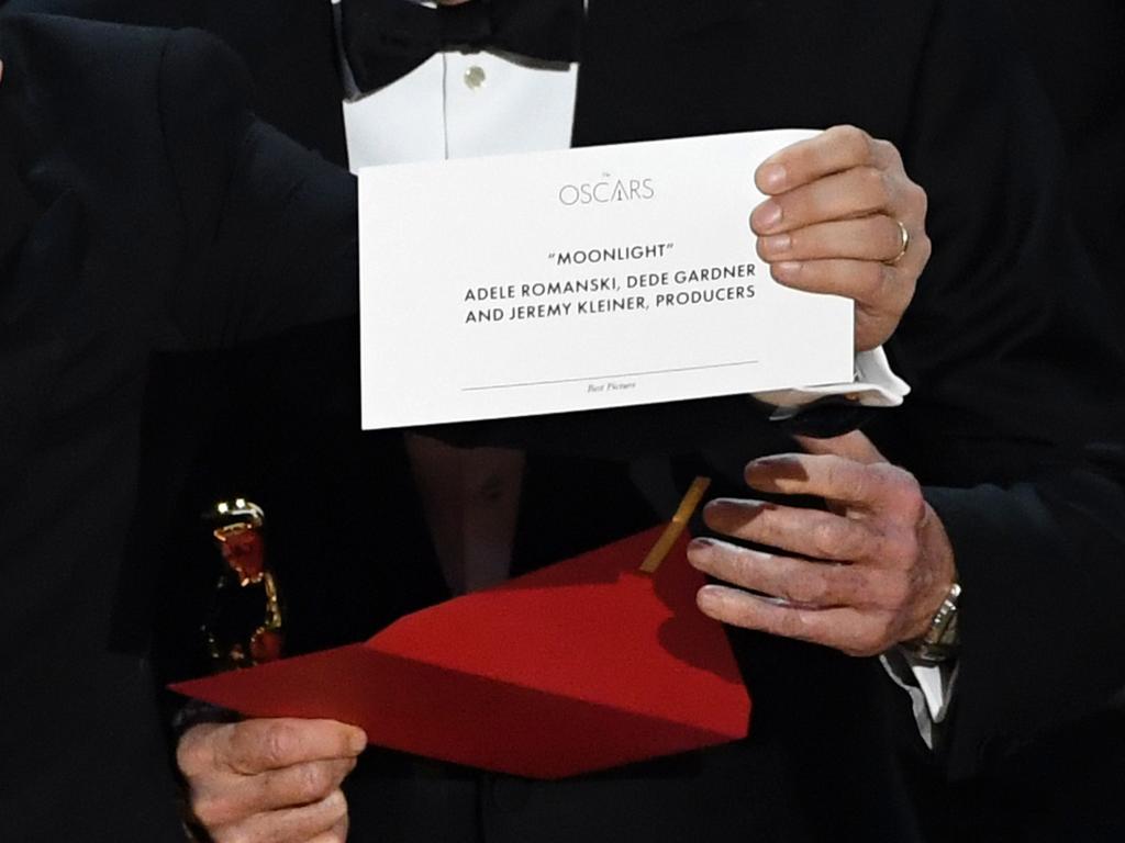 Detail shot as ‘La La Land’ producer Jordan Horowitz holds up the winner card reading actual Best Picture winner ‘Moonlight’ onstage during the 89th Annual Academy Awards. Picture: AFP