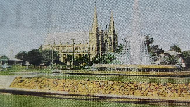 The coloured fountain with St Joseph's Cathedral in the background. Photo: Rockhampton and District Historical Society.