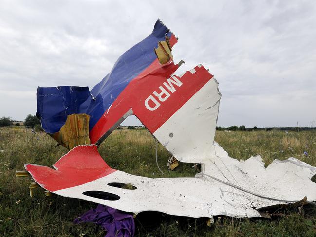 A piece of wreckage of the Malaysia Airlines flight MH17 is pictured on July 18, 2014 in Shaktarsk, the day after it crashed. Flight MH17 from Amsterdam to Kuala Lumpur, which US officials believe was hit by a surface-to-air missile over Ukraine, killing all 298 people on board.  AFP PHOTO / DOMINIQUE FAGET (Photo by DOMINIQUE FAGET / AFP)