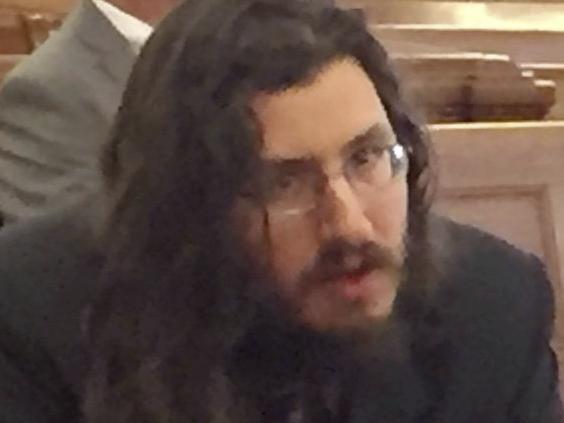 Michael Rotondo, left, sits during an eviction proceeding in Syracuse, N.Y., brought by his parents, Mark and Christina, of Camillus. The two parents confer with their lawyer, Anthony Adorante, in the court gallery behind. Rotondo told the judge Tuesday, May 22, 2018, he knows his parents want him out of their Camillus home, near Syracuse. But he argued heâ€™s entitled to six months more time.  (Douglass Dowty /The Syracuse Newspapers via AP)