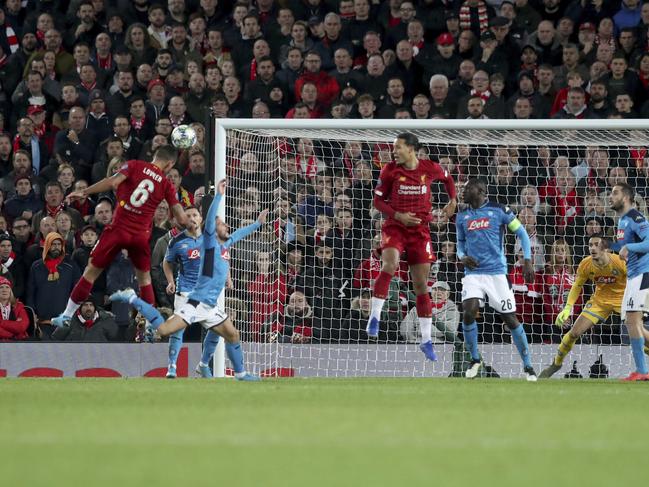 Liverpool's Dejan Lovren, 6, scores his side's first goal during the Champions League Group E soccer match between Liverpool and Napoli at Anfield stadium in Liverpool, England, Wednesday, Nov. 27, 2019. (AP Photo/Jon Super)