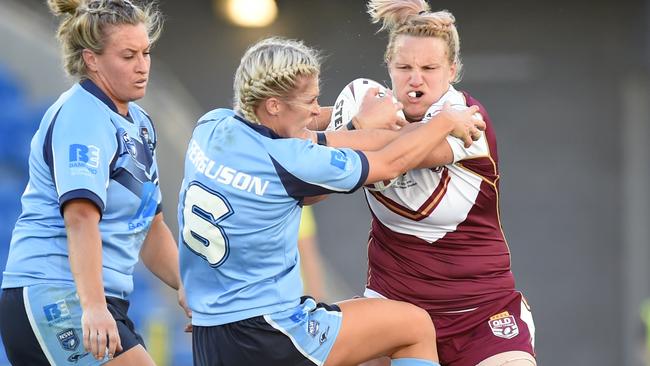 Allana Ferguson tackles a Queensland player during the women's Origin.