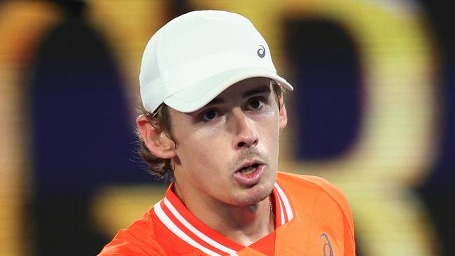 MELBOURNE, AUSTRALIA - JANUARY 17: Alex de Minaur of Australia celebrates match point after winning their round two singles match against Matteo Arnaldi of Italy during the 2024 Australian Open at Melbourne Park on January 17, 2024 in Melbourne, Australia. (Photo by Daniel Pockett/Getty Images)