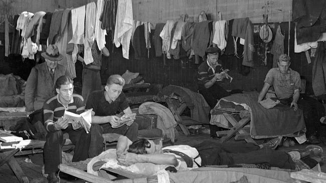 Unemployed men gather at St Vincent's Hostel, Brisbane towards the end of the Great Depression. File pictures