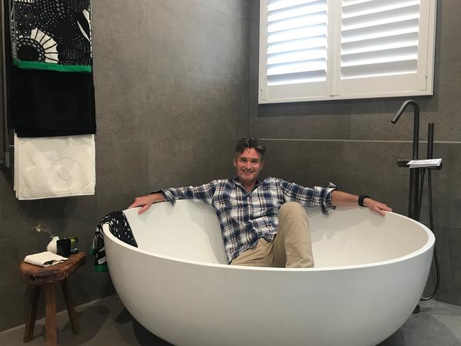 Dave Hughes in the bath tub of Josh and Elyse’s house he bought on The Block. Source: Supplied