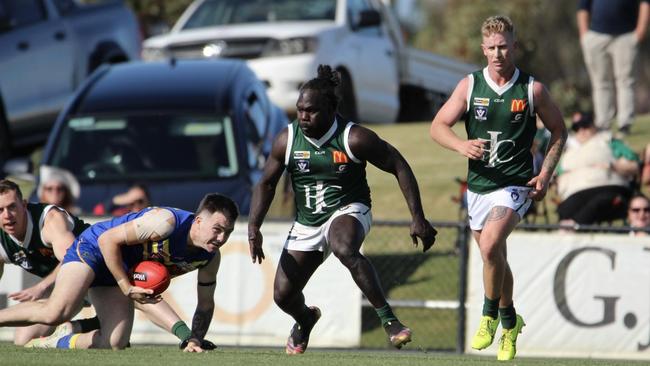 Anthony McDonald-Tipungwuti looks to apply a tackle. Picture: Rita Morello.