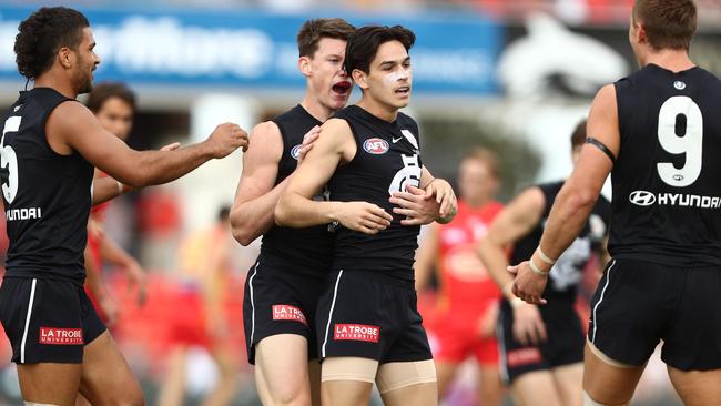 GOLD COAST, AUSTRALIA - APRIL 14: Zac Fisher of the Blues celebrates a goal during the round four AFL match between the Gold Coast Suns and the Carlton Blues at Metricon Stadium on April 14, 2019 in Gold Coast, Australia. (Photo by Chris Hyde/Getty Images)