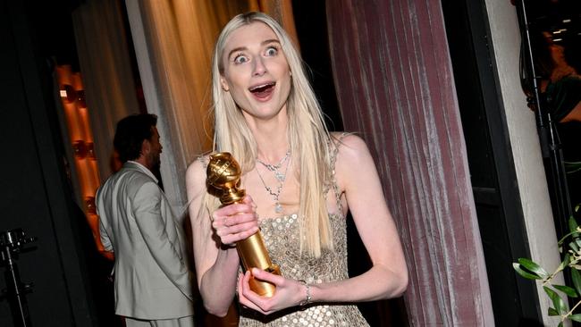 A delighted Elizabeth Debicki clutches her Golden Globe, which she won for her role as Princess Diana in The Crown. Picture: Getty Images