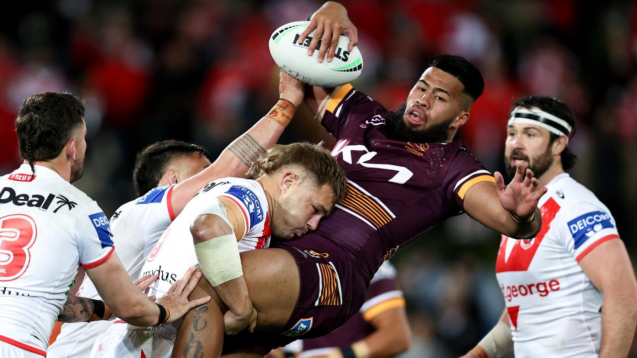 Payne Haas is upended by the Dragons’ defence. Picture: Brendon Thorne/Getty Images