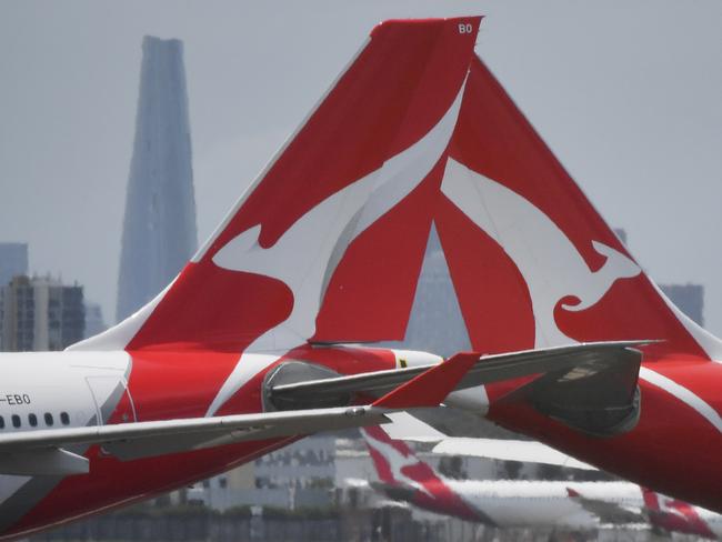 Qantas aircraft are seen at Sydney Airport, Thursday, 24 December 2020. Authorities are urgently investigating how a Qantas crew member contracted Covid-19 after arriving in Darwin from Paris and then flying to Sydney without being tested or quarantined. Federal health authorities are working with Qantas to understand how the man, who landed in Darwin on 17 December after working on a repatriation flight from Paris, became infected. Picture - Sam Mooy/The Australian Newspaper