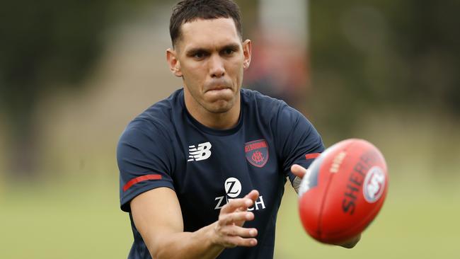 Harley Bennell completes some handball drills during a Melbourne Demons AFL training session.