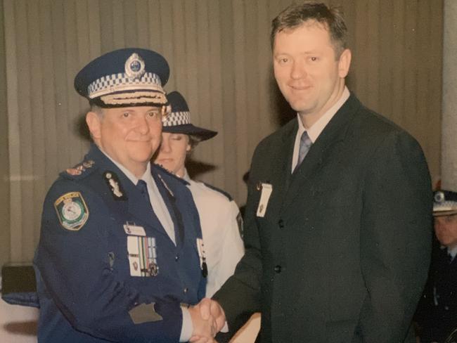 Ken and Peter Moroney pose for a picture after Peter received an award for community work. Picture: Supplied