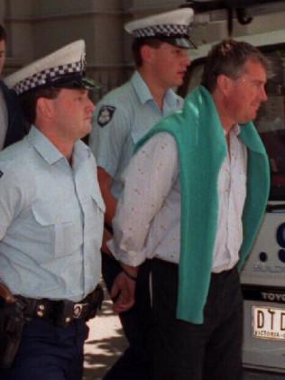 Ashley Coulston, right, with police in 1993. Picture: Rob Baird