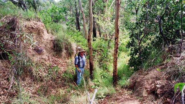 Kevin Parkes stands in a WWII bunker found with a GPS system near Mt Louisa. Evan Morgan