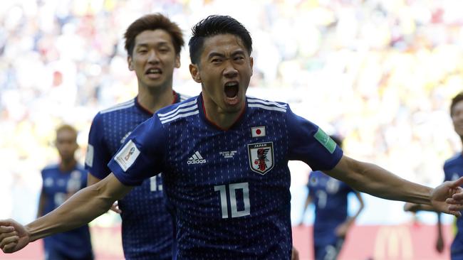 Shinji Kagawa celebrates after scoring his penalty early in the first half against Colombia. Picture: AFP