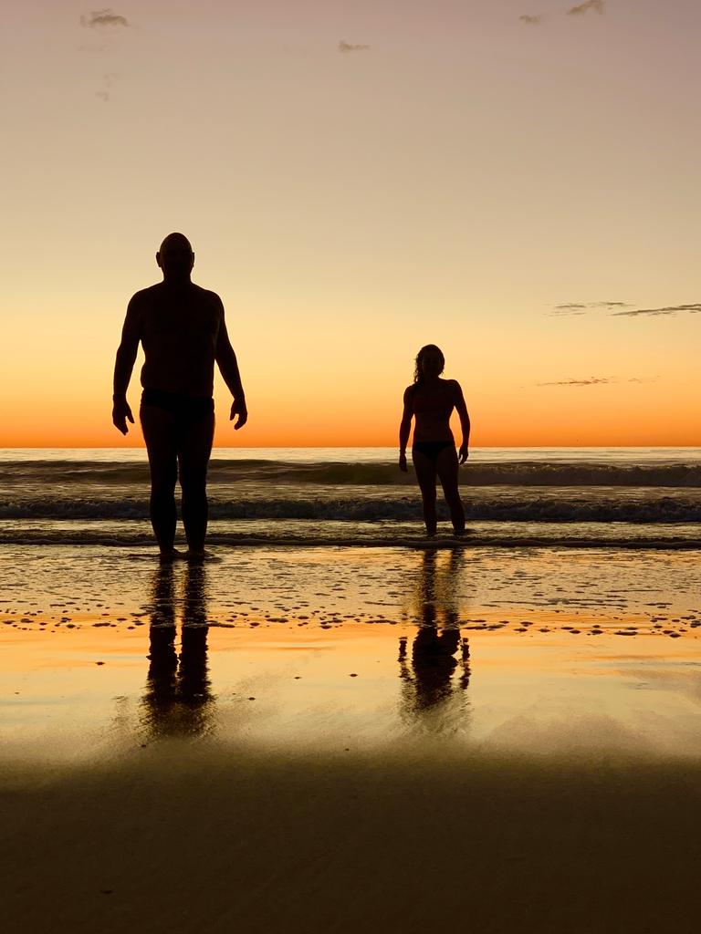 Early morning swimmers at Surfers Paradise. Picture Jenny Masters