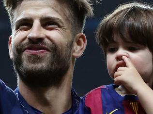 BERLIN, GERMANY - JUNE 6: Gerard Pique of Barcelona and his son Milan Pique Mebarak celebrate the victory after the UEFA Champions League Final between Juventus Turin and FC Barcelona at Olympiastadion on June 6, 2015 in Berlin, Germany. (Photo by Jean Catuffe/Getty Images)