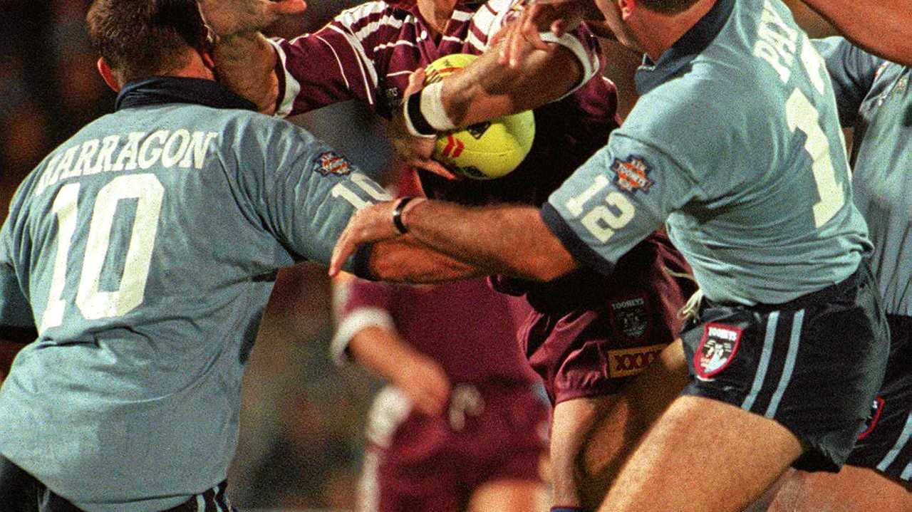 State of Origin Qld vs NSW at Suncorp Stadium. Gary Larson in attack against Paul Harragon and Dean Pay. Game I - May 20, 1996. Picture: Geoff McLachlan