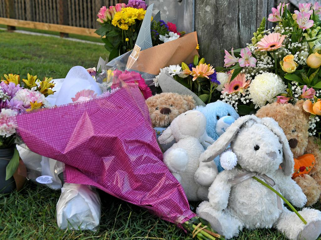 Flowers and cards left at the scene on Raven street. Picture: AAP image, John Gass.