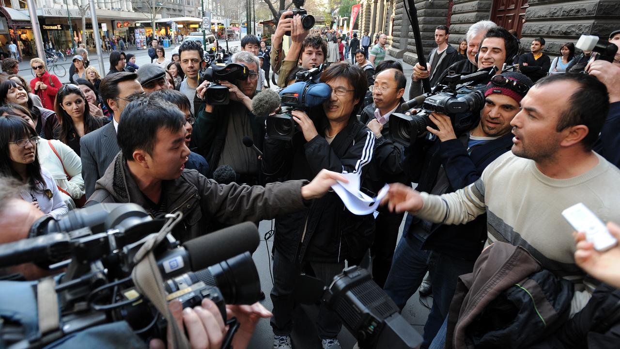 A Uyghur protester confronts a Chinese protester outside the Melbourne Town Hall ahead of the screening of 10 Conditions of Love, a documentary about Xinjiang in 2009. Picture: Joe Castro/AAP