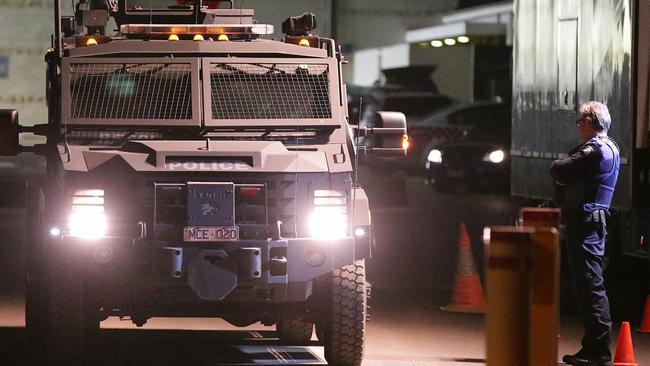A heavily-armoured police vehicle leaves the Metropolitan Remand Centre last night. Picture Norm Oorloff