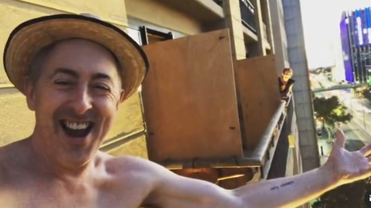 Alan Cumming sings on the balcony during his time in quarantine in Adelaide. Picture: Alan Cumming/Instagram