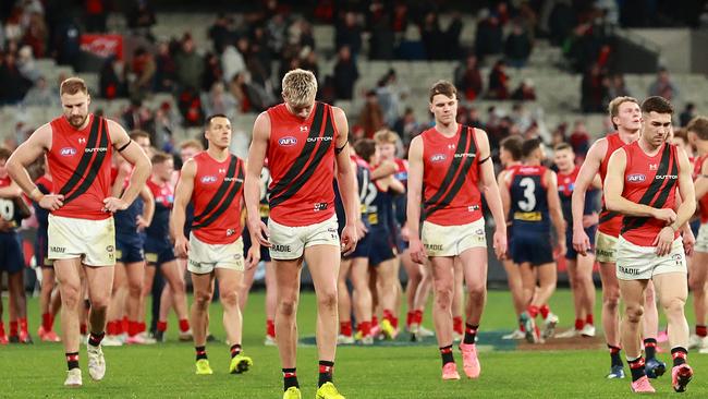 Bombers coach Brad Scott says they failed to play ‘pretty simple footy’ in wet weather at the MCG on Saturday night. Picture: Kelly Defina / Getty Images