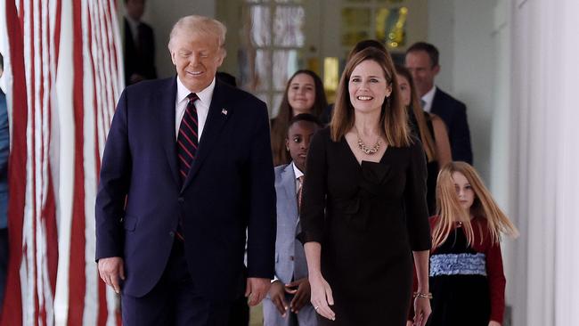 US President Donald Trump and Judge Amy Coney Barrett, arrive at the Rose Garden of the White House in Washington, DC.