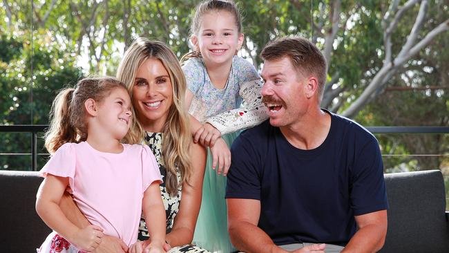 David and Candice Warner at home with two of their three daughters, Indi and Ivy. Picture: Justin Lloyd.