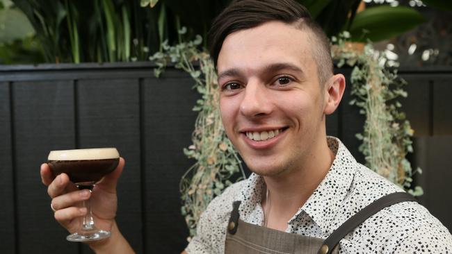 The Gully Public House and Garden duty manager Kris Ball with their fabulous Martini Mocha cocktail. Picture: AAP/Emma Brasier