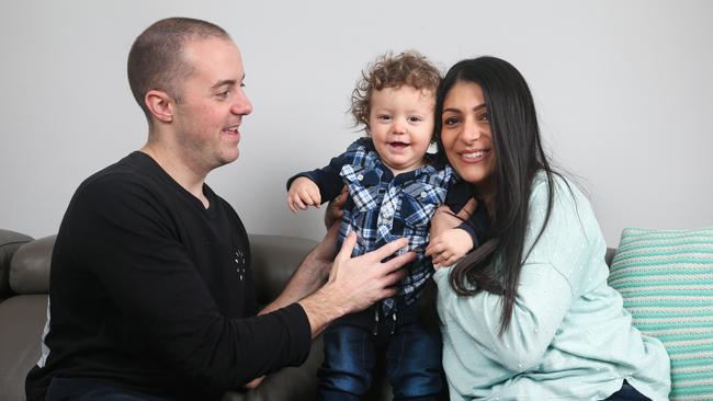 Spencer, 16 months, took part in the trial to help prevent food allergies. Pictured with his parents Chris and Lia Duke. Picture: Ian Currie.