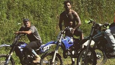 Latrell Mitchell and Josh Addo-Carr on motorbikes at a beach. Picture: Instagram