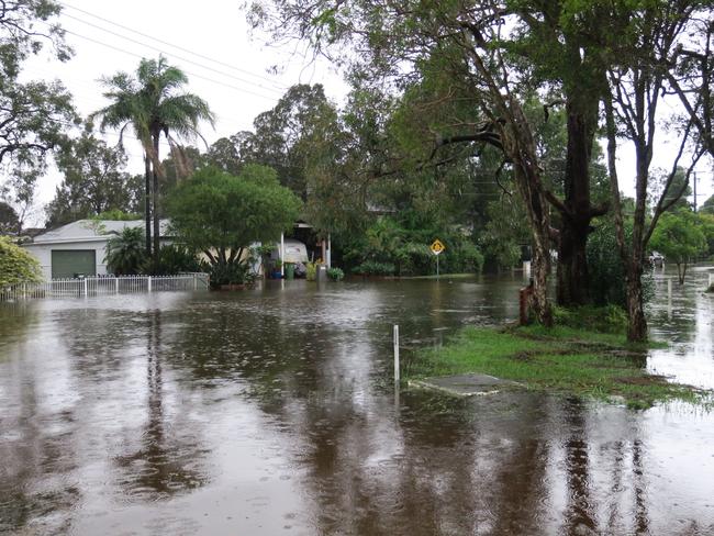 A common sight in Lakedge Ave, Berkeley Vale, following torrential rain. Picture: Richard Noone