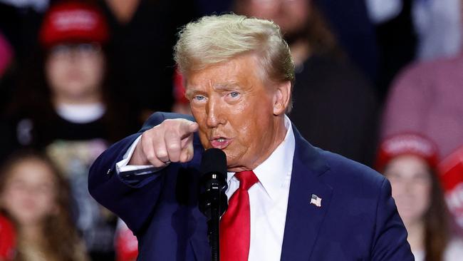 Donald Trump gestures as he speaks during a campaign rally at Van Andel Arena in Grand Rapids, Michigan.