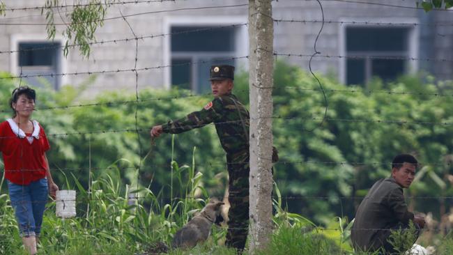 Peasant life under the eye of the military in North Korea. Picture: Zhang Yufei