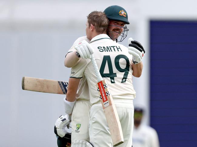 Steve Smith (L) and Travis Head share a hug following Smith’s century on Day 2 of the Gabba Test. Picture: Getty