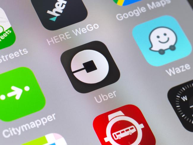 London, UK - November 11 2016: The buttons of Uber, Here WeGo, Waze, Maps, Citymapper, Google Maps, Cyclestreets and Compass travel apps on the screen of a mobile phone