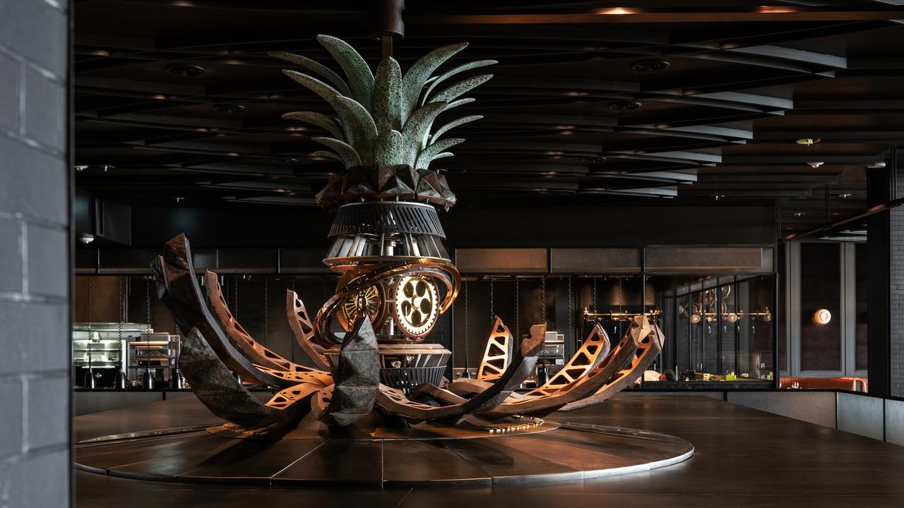 A huge mechanical pineapple opens and closes through dinner service. It is linked to the spit roasting pineapples for the iconic ‘tipsy cake’ dessert. Picture: Instagram / dinnerbyhbdubai